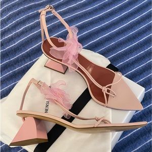 Nensi Dojaka distinctive aesthetic intricate thong sandals.